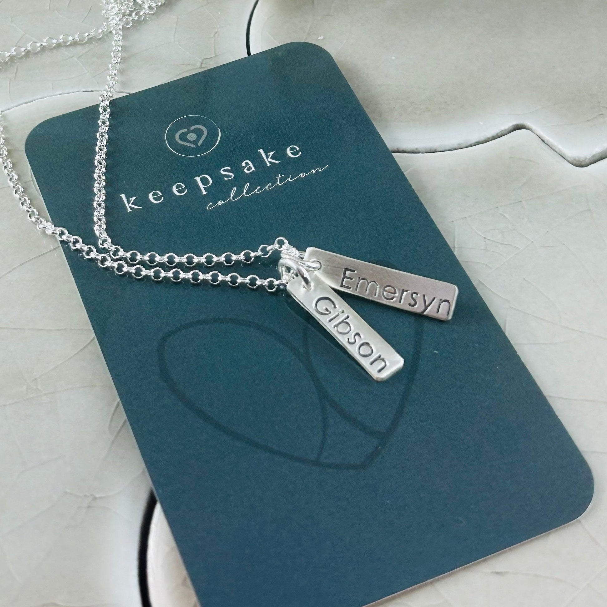 Personalized fine silver name tag necklace with up to 3 custom tags. Comes with an 18” rolo chain, with the option to upgrade for a longer length.