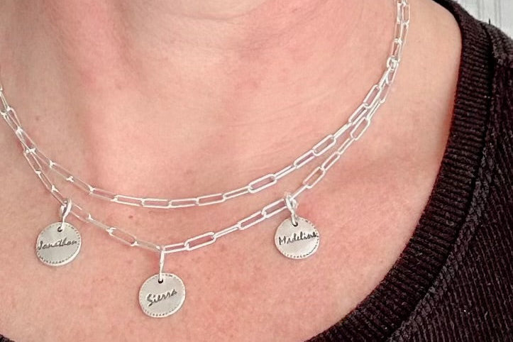 Sterling silver paperclip necklace with three custom 99.9% fine silver mini disc charms, designed for versatile wear as a long, short, lariat-style necklace or bracelet.