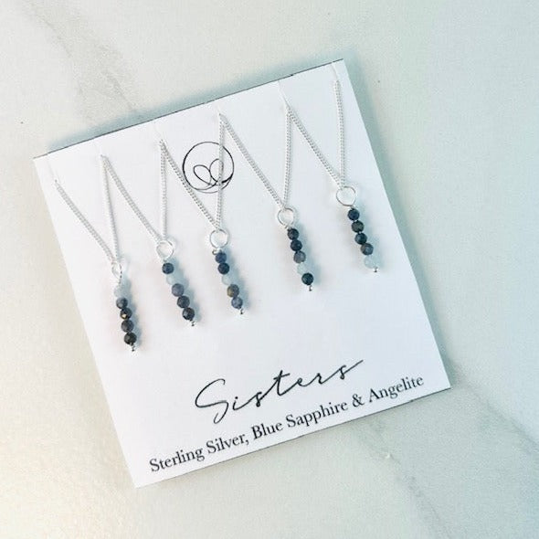 Sister necklace set with Angelite and blue sapphire stones. The set has 5 separate necklace with a different colour stone placed to show the birth order of that sister.