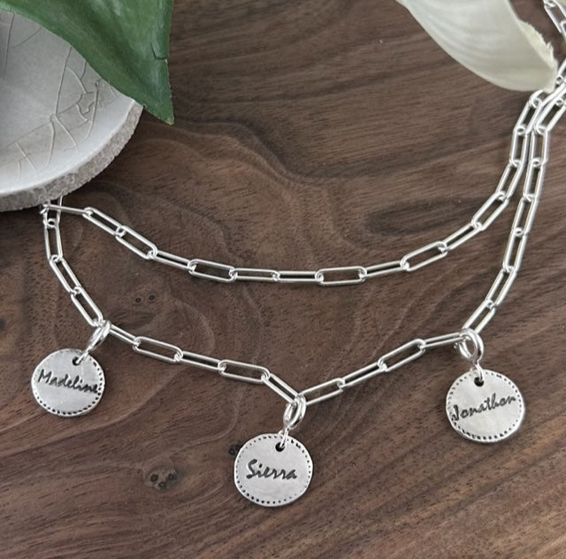 Sterling silver paperclip necklace with three custom 99.9% fine silver mini disc charms, designed for versatile wear as a long, short, lariat-style necklace or bracelet.