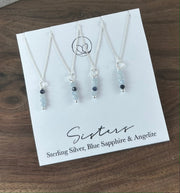Sister necklace set featuring Iolite stones, subtly symbolizing the bond between siblings. The darker stone placement represents the older or younger sister.  This set includes 4 separate necklaces.