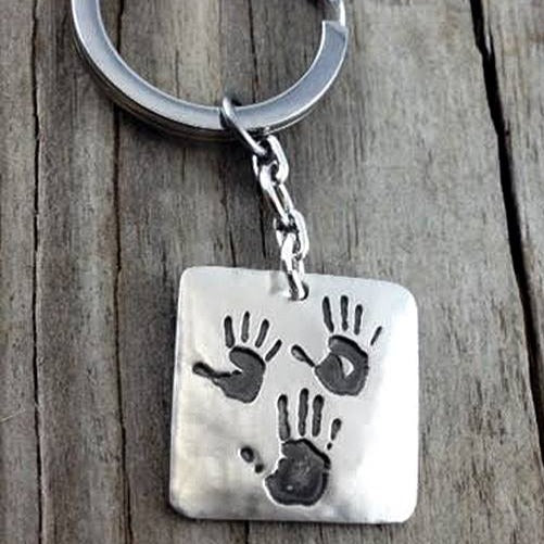 Fine silver square pendant showcasing actual hand and/or footprints. A meaningful keepsake, customizable with an optional chain or keyring.