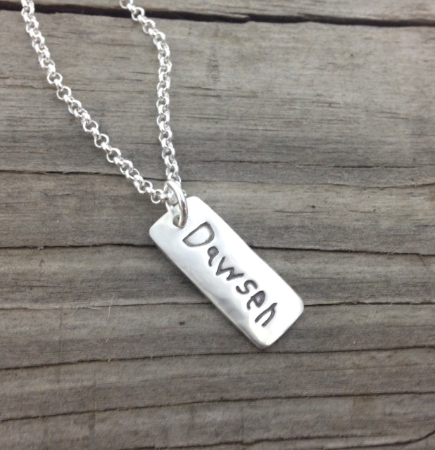 Fine silver rectangle pendant showcasing real handwritten messages. Customize with writing from a loved one’s letter, card, or your own personal note.