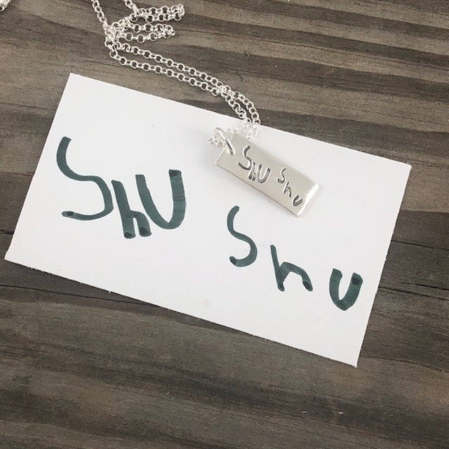 Fine silver rectangle pendant showcasing real handwritten messages. Customize with writing from a loved one’s letter, card, or your own personal note.