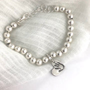 Sterling silver charm bracelet, a meaningful alternative to a family ring. Add charms for each loved one, easily rearrangeable with sterling lobster clasps.
