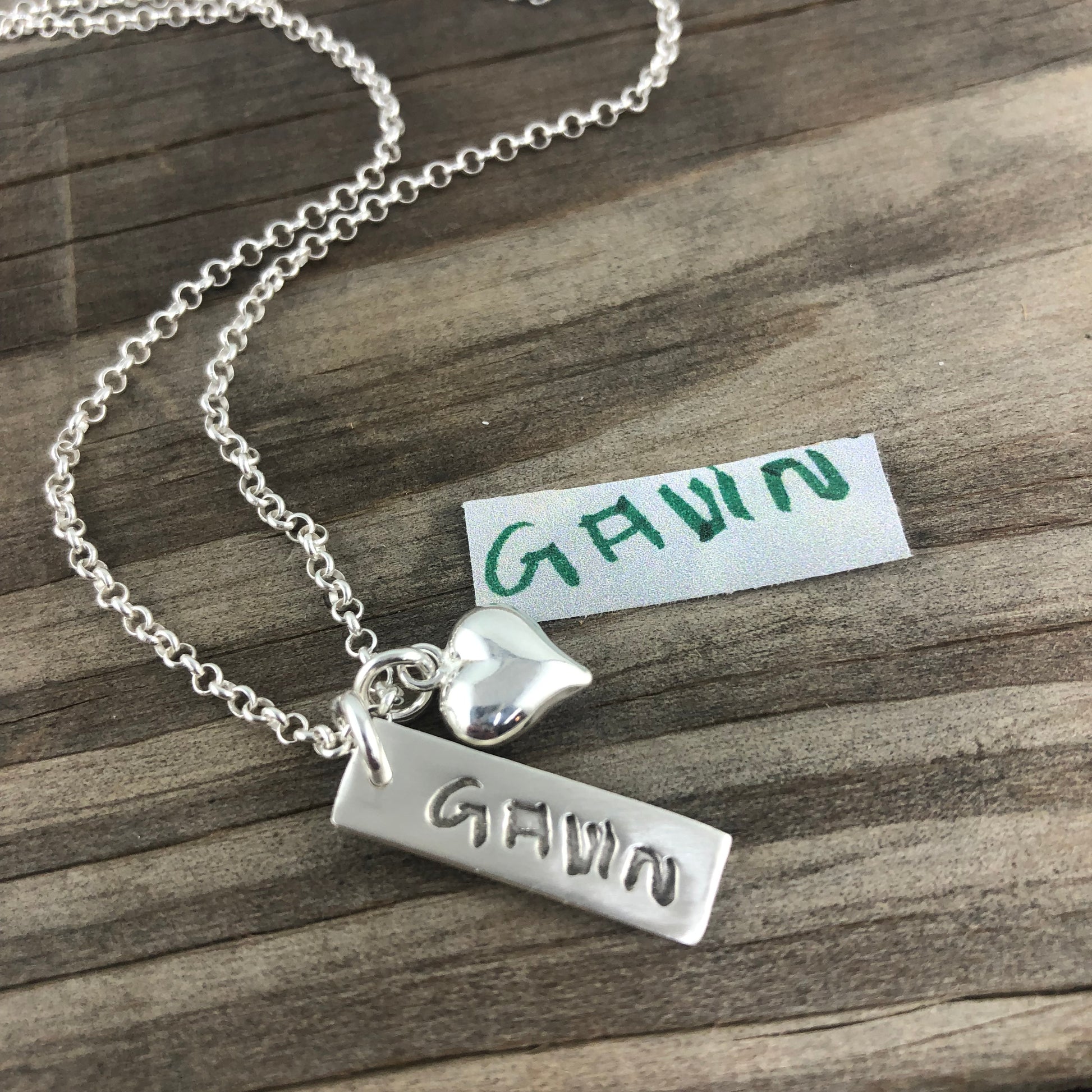Fine silver rectangle pendant showcasing real handwritten messages. Customize with writing from a loved one’s letter, card, or your own personal note.
