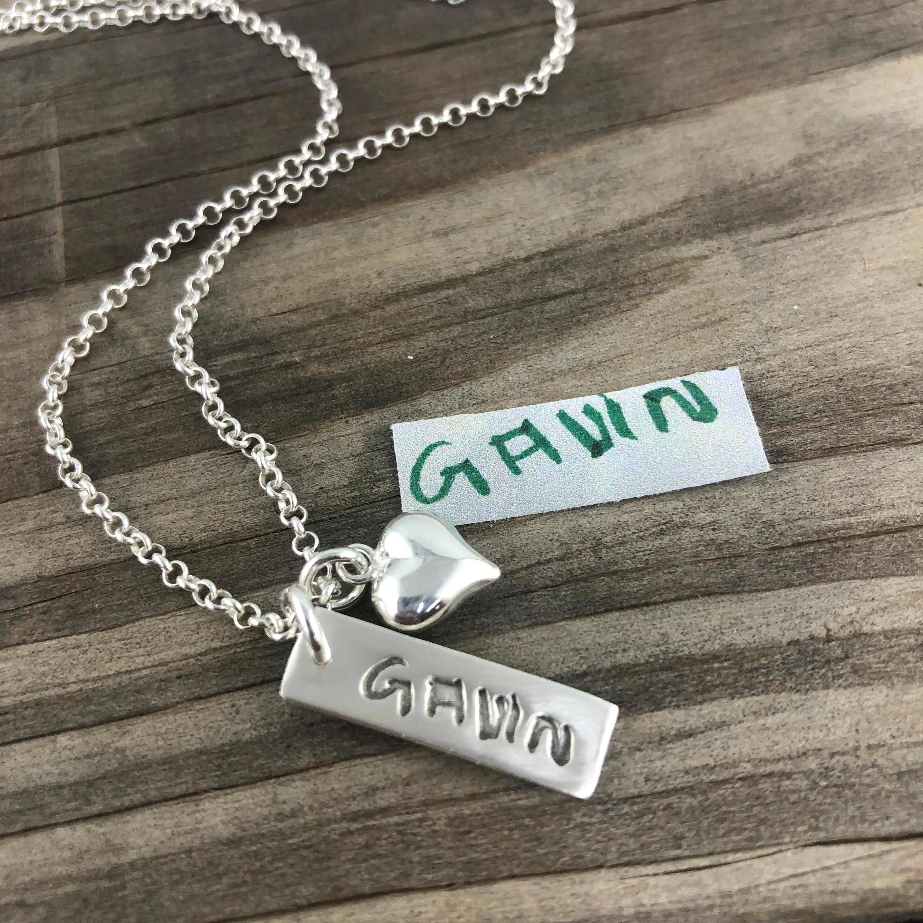 Fine silver rectangle pendant showcasing real handwritten messages. Customize with writing from a loved one’s letter, card, or your own personal note.