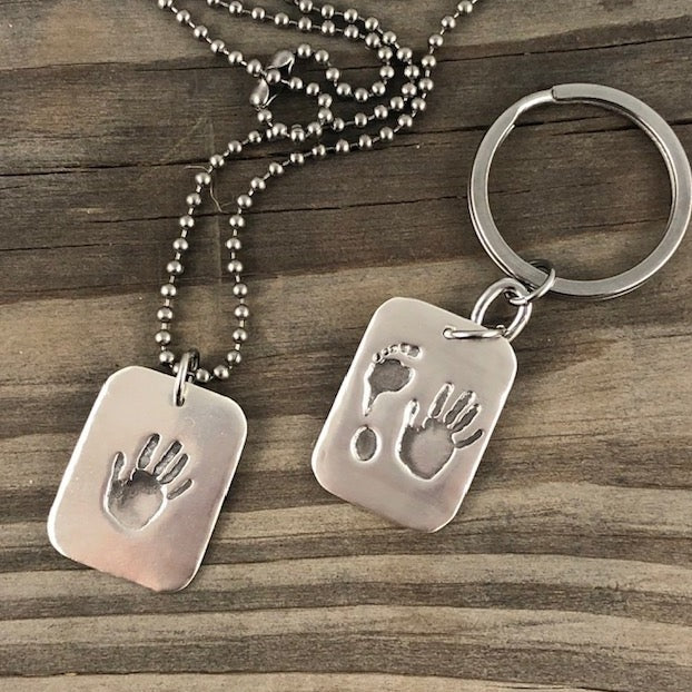 Fine silver dog tag pendant for men, personalized with real hand and/or footprints. A meaningful keepsake to honor a loved one's unique touch.