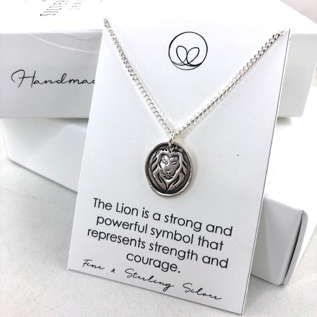 Handmade fine silver Lion pendant on an 18" sterling silver chain.  Represents strenth and courage.