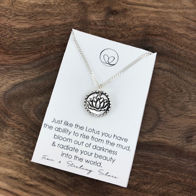 Fine silver lotus pendant on an 18” curb chain, representing growth, resilience, and beauty. Handcrafted with patina accents for a detailed and meaningful design.