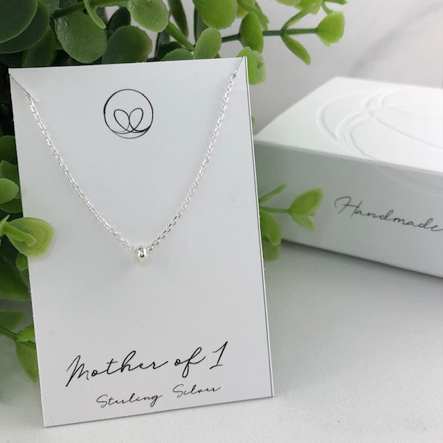 Sterling silver mother necklace with one beads, symbolizing love and connection. Handmade with care for a meaningful and sentimental keepsake.