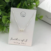 Sterling silver mother necklace with three beads, symbolizing love and connection. Handmade with care for a meaningful and sentimental keepsake.