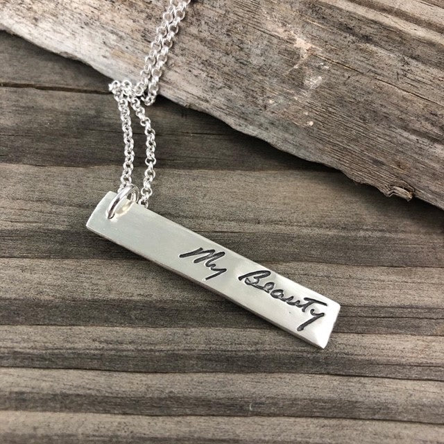 Rectangle shaped pendant repicating your loved ones handwriting.  Choose to add optional chain or embellishments.