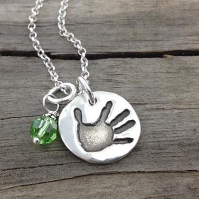 Small handcrafted fine silver circle pendant your child's actual  hand or footprint.