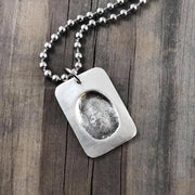 Dog Tag shape fine silver fingerprint pendant showcasing the exact indentation of a loved one's finger, crafted from a putty print for a unique and sentimental keepsake.