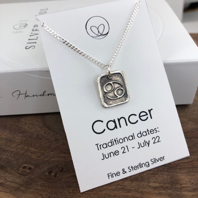 Cancer pendant on an 18" sterling silver chain.  The pendant is handmade with fine silver. 