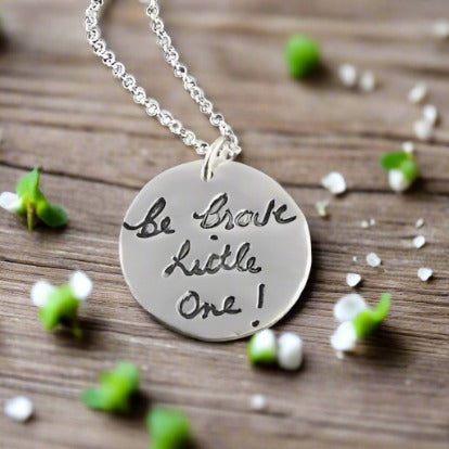 Fine silver large circle pendant showcasing a handwritten message from a loved one. Customize with personal writing or text from a cherished letter or card.
