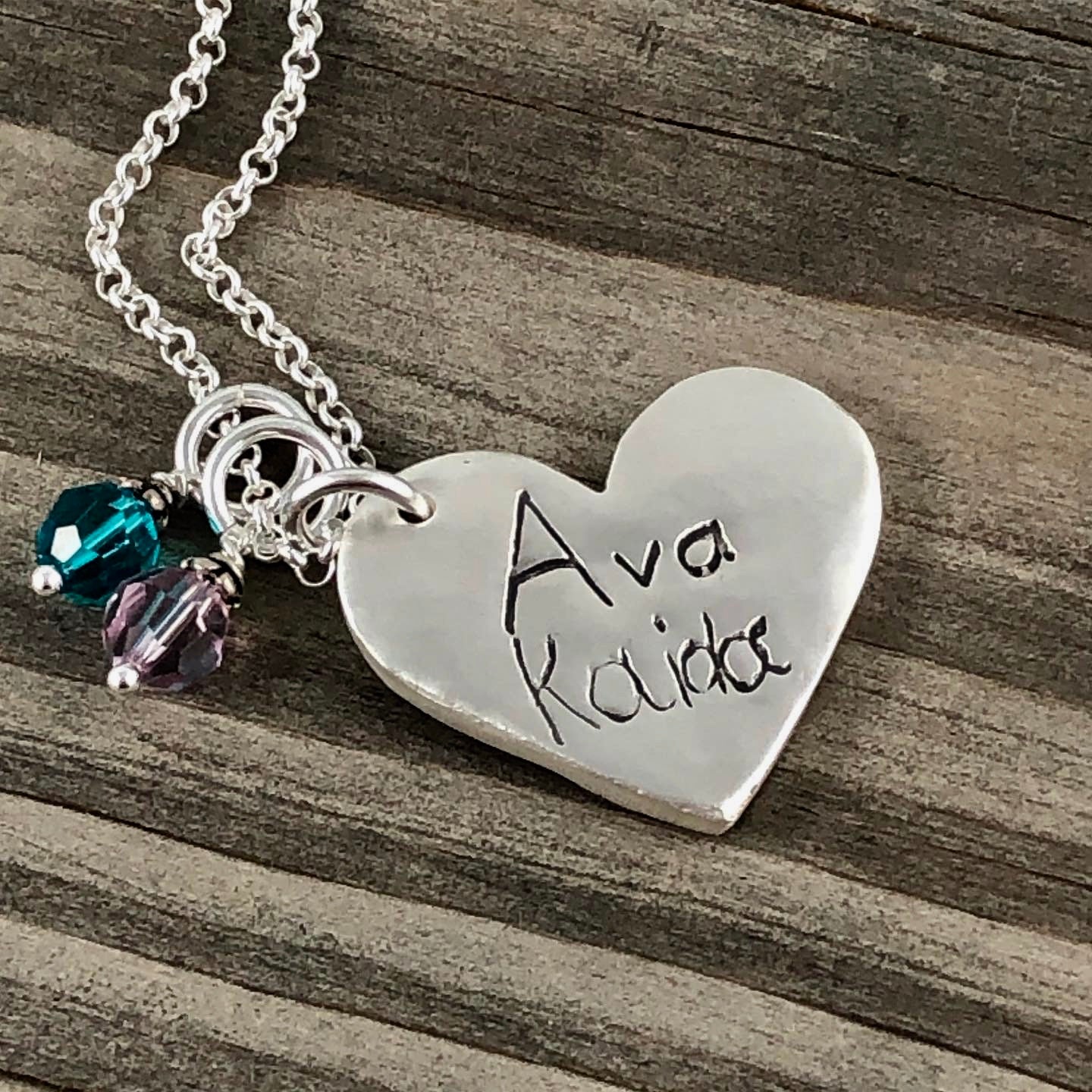Fine silver heart pendant showcasing a handwritten message. Personalize with up to 10 letters from a letter, card, or your own writing. Optional chain available.