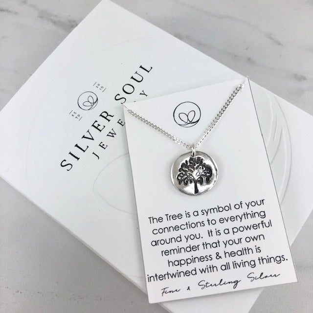 Fine silver tree pendant on an 18” curb chain, symbolizing connection to family and nature. Handcrafted with patina accents for added detail.